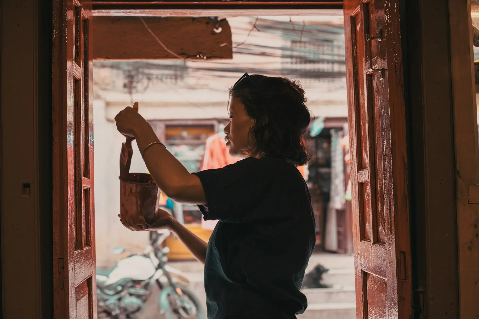 New business owner opening the doors of her shop in the morning