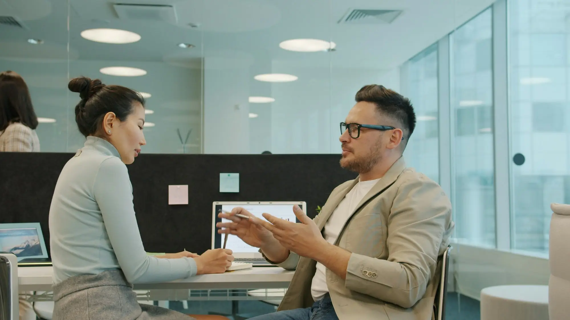Business owner discussing a loan with a lender in a meeting room