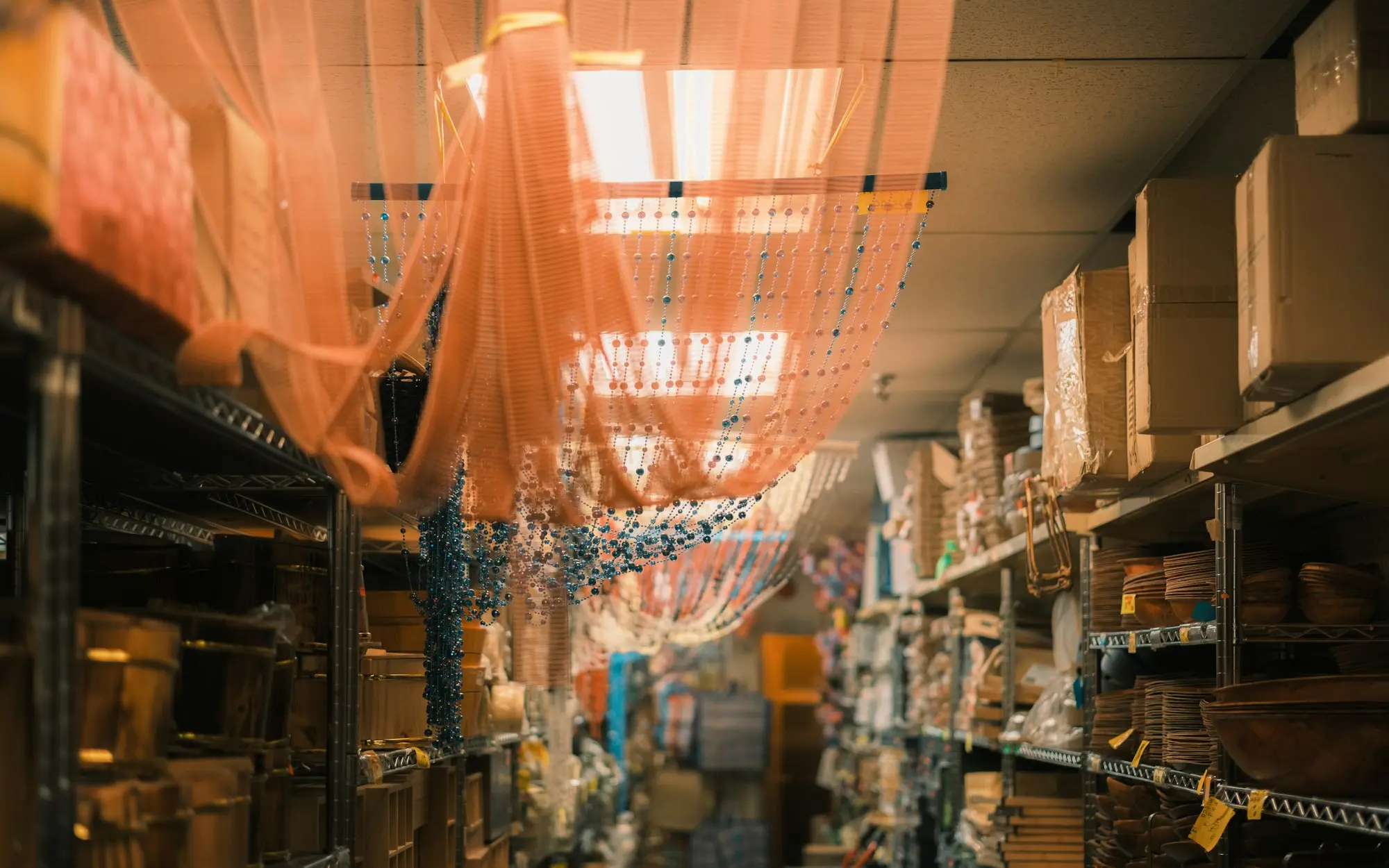 Retail stockroom lined with shelves of boxed stock